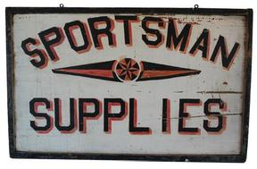 B104 Trade Sign circa 1930's for sportsman supplies with painted black lettering having red and yellow shadows and a central star motif
