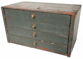 H1034 Late 19th century Pennsylvania stack of four drawers in old green over original pumpkin painted surface. Top drawer features divided interior.   Measurements: 19 ½ wide x 11 deep x 11 tall.