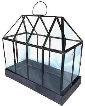 **SOLD** L4 Unique vintage metal and glass Terrarium for indoor plants. Glass panels fit snugly in soldered metal frame. All solder joints are secure. Entire house shaped top lifts off tray for easy access to plants. Top measures 16 ½ wide x 8 ½ deep. Bottom tray measures 17 wide x 8 ¾ deep. Overall height is 15 ¾ tall.  