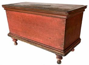 **SOLD** H526 Early 19th century diminutive Lancaster County, Pennsylvania blanket chest in original salmon painted surface. This wonderful chest features a dovetailed case with molded top and bottom resting on gracefully turned feet. Original hinges. Square head and T-nail construction. Measurements: 19 ¼� wide x 8 5/8� deep x 11 3/8� tall.
