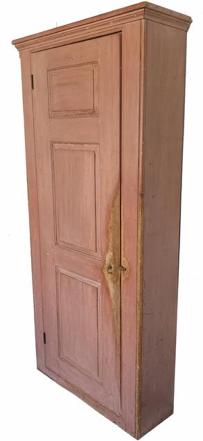 G545 Early 19th century outstanding  New England Pantry Cupboard  being 37" wide ,tall one door storage pantry / cupboard in original dry salmon paint. The door features three graduated raised panels with molded edges and beaded edge around the outer edge of the door. Beaded edge on both front corners. Original molding around the top. Seven shelves inside can be repositioned to accommodate any collection of items. Fantastic wear, especially on the door, that indicative of age and years of use.  Circa 1800- 1820 Measurements: 84 1/2� tall. Case is 37 1/2� wide x 12 3/4� deep. The molded top is 40� wide. The shelves are 10 5/8� deep.