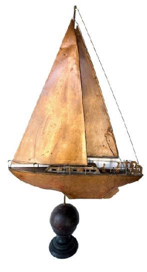 L294 Unique large copper weathervane depicting a sailboat with cutouts of people on deck. Mounted in/on an oversized architectural ball for display purposes. Great original surface patina.  Approximate measurements: 29 &frac14;� long x 5 &frac12;� wide x 50 &frac12;� tall (mounted).  