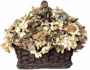 G638 Original vintage floral arrangement by folk artist, Doris Stauble (1917-2007) of Wisscesset, Maine. Arrangement consists of many varieties of small sized silk, natural and burlap flowers topped with two tiny birds, tightly arranged in an early wooden basket. 