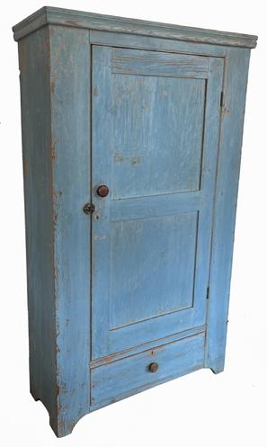 *SOLD* J265 Spectacular early 19th century Pennsylvania original robin-egg blue painted cupboard featuring one triple-mortised and double-pegged door over one dovetailed drawer. Cupboard boasts dovetailed case, applied molding at the top and cut out feet/ends. Beaded edging surrounds the door and drawer. Circa 1830-1840�s. This piece was originally a wardrobe with original wooden pegs around the top inside. Two interior shelves were later additions to add additional storage. Measurements at top molding: 42 ½� wide x 14 ¾� deep. Overall height is 70 ¼� tall. 