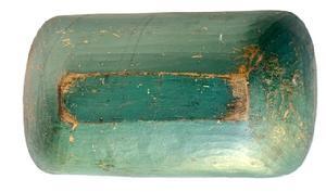 L503 19th Century New England Trencher with original green paint. Wonderful hand-hewn surface. The inside of the trencher bears natural patina surface with evidence of chop marks and a hole in one end for hanging purposes. Trencher is hewn from one solid piece of wood. Measurements: 17 ¾ long x 9 ¾ wide x 3 ½ deep.
