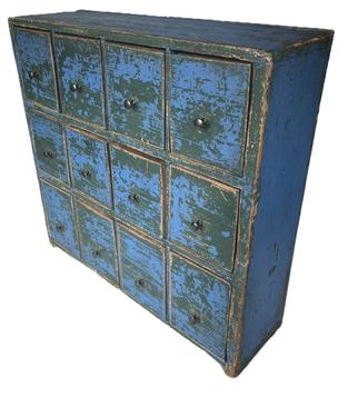 K1731 Twelve drawer 19th century Apothecary bearing vivid old blue over original green painted surface featuring three rows of drawers with mortised stretchers. The bottom row of drawers if slightly larger than the top two rows. Each of the drawers has shaped sides and original pale-yellow painted interiors. Found in Pennsylvania. Pine with small wire nail construction. Great size  versatile enough that it can sit atop a flat surface or be hung on the wall.   Measurements: 18 ½ wide x 5 ½ deep x 18 tall.  