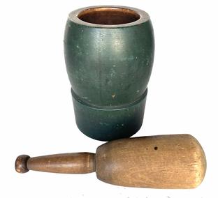 G693 19th century original green painted Mortar and Pestle.  Each part is turned from one solid piece of wood. Both the pestle, and the interior of the mortar, retain wonderful natural patina. There are several surface cracks to the bottom, that do not reach the bowl � and one tight hairline crack at top of rim, along with a nick in the wood along the interior of the rim as seen in photos � neither of which detract from the visual appeal of this piece. Very sturdy with good weight. The Mortar measures 8� tall x 5 ¼� diameter with a 2 7/8� wide band around the bottom before the sides curve around the bowl. Pestle measures 10� long x ~2 ½� diameter at bottom and shows wear indicative of years of use.