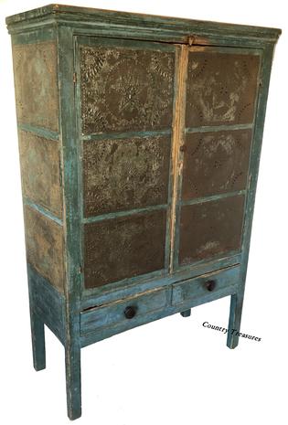 D517 Early 19th century twelve star tin Pie Safe, from Western Maryland, in the original blue paint, two  doors,over  two drawers, the tins are all hand punched, circa 1820 Measurements are  16 1/4" deep x 37 1/4" wide x 56 1/2"