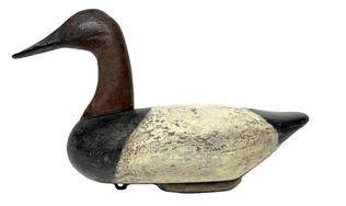 **SOLD** RM1643 Maryland high-head Canvasback Drake decoy by unknown carver. Retains early iron keel weight and staple on bottom. Surface appears to be a second coat of working paint. This decoy has influences of the Holly family of carvers.