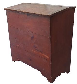 C474 19th century Storage Bin from Pennslyvania, with originnal red paint, lift lid, with a slight canted front, square head nail construction, with a nice high cut out foot. circa 1870
