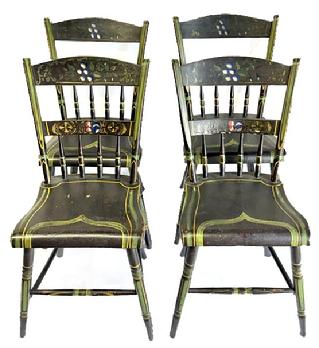 M207 Early 19th century Pennsylvania set of four matching plank bottom Chairs with paint decoration. The background color is black with green decoration.  The crest of the chairs feature fruit and leaves, in blue and white, red and gold. A flower motif adorns the middle crest and wide decorative striping adorns the seats. All four Chairs are matching, have great painting and are in great condition. Circa 1830 � 1850. Measurements:  Seats are 15 &frac14;� wide x 14� deep. Seat height is 17 &frac12;�. The backs are 32 &frac14;� tall. 