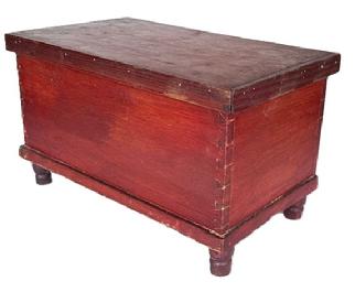 LL138  19th century miniature Pennsylvania blanket chest with original red painted surface bearing applied molding around lid that opens to reveal clean, natural patina interior with a small lidded til inside. Chest rests on applied turned feet. Small square head nail construction. The wood is pine.  Circa 1850s-1880s. Measurements:  15 ¾ wide x 9 ¼ deep x 9 ¼ tall.  