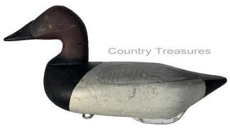 RM1051 Early Bob McGaw Canvasback Drake decoy. Paint is a second coat of working paint, also done by McGaw. Original �dog bone� weight and iron ring on bottom.