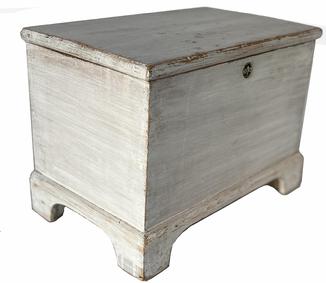 H933 Mid-19th Century Lancaster County, Pennsylvania miniature blanket chest with applied bracket base in original white painted surface. Clean, natural patina interior. �T� nail construction. Original hardware and escutcheon. Circa mid-1800's. Measurements: 14 ¼� wide x 8 ½� deep x 10� tall