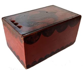 H331 Berks County, Pennsylvania slide lid box retaining beautiful original red and black paint decorated surface. Dovetailed case. Lid has three symmetrically carved indentations on one end for fingers to easily open/close the smoothly sliding lid. Clean, natural patina interior. Circa 1790 - 1810. Measurements: 11" long x 7" wide x 6" tall