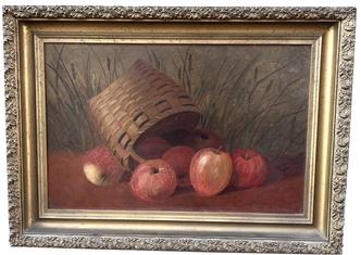 H1021 Beautifully framed oil on canvas depicting a toppled over basket of apples - signed and dated in lower right corner "M L M 1911". Nice gold leaf frame. Framed measurements: 22 1/� wide x 15 ¼� tall x 2� deep. Painting area measures 18� wide x 11 ¾� tall