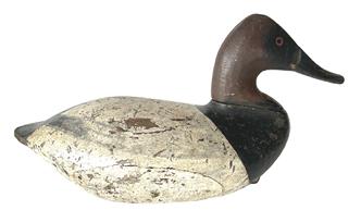 RM1379 Canvasback Drake Decoy by John Graham (1822-1912) of Charlestown, Maryland. Branded �GRACE� on bottom. Retains nice, early working re-painted surface with evidence of being shot over. Original iron weight, staple and ring intact on bottom. Approximate measurements: 14 ½� long x 7 ½� wide x 7 ½� tall