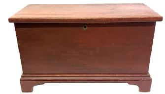 M301 Early 19th century original red painted Pennsylvania blanket chest with dovetailed case, applied bracket base and molded edge around lid. Clean, natural patina interior with lidded till inside. A large early circular picture of the legendary American Standardbred pacer horse named �Dan Patch� who set the world record for the fastest mile by a harness horse at 1:55 remains intact inside the lid. Square head nail construction. Circa 1830s. Measurements: 33 &frac34;� wide x 16 &frac34;� deep x 20� tall.