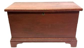 M301 Early 19th century original red painted Pennsylvania blanket chest with dovetailed case, applied bracket base and molded edge around lid. Clean, natural patina interior with lidded till inside. A large early circular picture of the legendary American Standardbred pacer horse named �Dan Patch� who set the world record for the fastest mile by a harness horse at 1:55 remains intact inside the lid. Square head nail construction. Circa 1830s. Measurements: 33 &frac34;� wide x 16 &frac34;� deep x 20� tall.