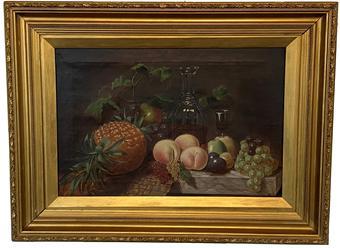 F478 Antique oil on canvas still life painting in its original gold gilt frame.  In the painting, there are  pineapples, grapes, peaches, apples, decanter of wine and Basket on a dark background. Outside measurements: 32" wide x  24" wide
