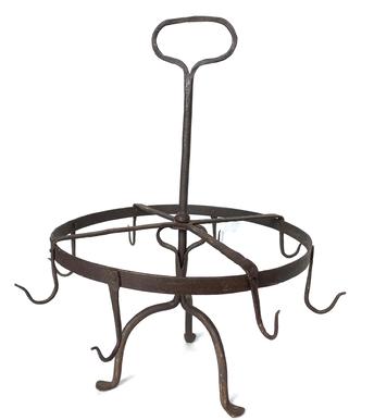 *SOLD* G619 Spectacular 18th century forged Iron rotating apple roaster from Ohio. Circular, freely pivoting ring with eight hand forged hooks rests upon a semi-heart shaped bracket attached to a center post that leads to a 2 1/4" x 3 3/4" wide oval handle for carrying. The rack rests upon on a tripod padded-foot base. Wonderful hammer marks visible throughout. Excellent condition.  This versatile piece could also have been used for roasting small birds. Measurements are: 16 1/2" tall x approximately 14 1/2" across (hook point to hook point). The ring is 5/8" wide and each hook measures 3 - 3 1/2" long.