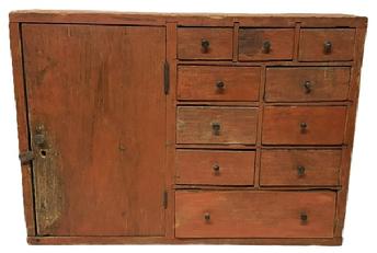 **SOLD** M264 Mid 19th century New England Apothecary Cabinet � featuring a very unusual layout with a hinged door to the left with interior shelf and a series of ten (10) drawers to the right in a 3 over 2 over 2 over 2 over 1 configuration, with the top 3 drawers having divided interiors. The case and drawers are dovetailed construction with the drawer stretchers/dividers being mortised. The woods are pine and poplar. Extensive mouse/rodent holes and related damage to back and interior of drawers. Measurements: 30� wide x 8� deep x 21 &frac14;� tall. 