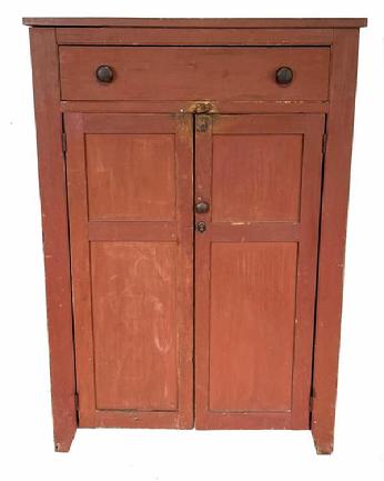 H520 Tall, early 19th century Pennsylvania original red painted jelly cupboard with one large, dovetailed drawer over two paneled doors. Half-moon cut out ends. Clean, natural patina interior with shelves for storage. Beaded edge around drawer and doors. Square head nail construction. Measurements: 40� wide x 17� deep x 57 ½� tall      