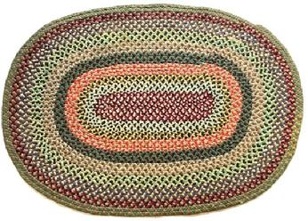 RM1453 Handmade oval braided rug  mixed wool fabrics with a burgundy center, red/tans, a hint of yellow and greens around the outer edge. Very nice condition. Measurements: 50 1/4" x 36".  