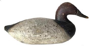 G680 Canvasback Decoy carved by Charlie Joiner (1921-2015) of Chestertown, MD. Original paint and retains original iron weight and ring on bottom. Circa mid 1960s.