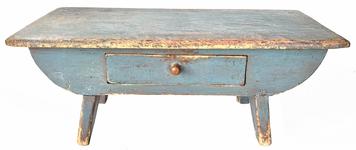 **Sold**H987 19TH Century pine footstool with drawer boasting a beautiful old blue painted surface over the original red paint. Decorative cut out tapered legs with drop apron on each side. Nailed construction. Measurements: 20� wide x 9 ½� deep x 8� tall. 