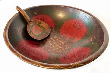 L120 Large identified Pennsylvania painted wooden bowl with tole painted interior featuring four large tomatoes and matching tole painted wooden butter paddle. The bowl is signed and dated on its slightly footed base: Helen M Banks 1946 and the paddle is signed H. Morris Banks on its back. Mrs. Helen Morris Banks (1903-1977) from Mifflintown, PA taught the art of tole painting and she also organized the first public library in Juniata County, PA in the late 1930s. The bowl measures: 18 ¾ x 20 top diameter x 5 ¾ deep. The butter paddle measures 9 5/8 long x 5 ¾ wide.