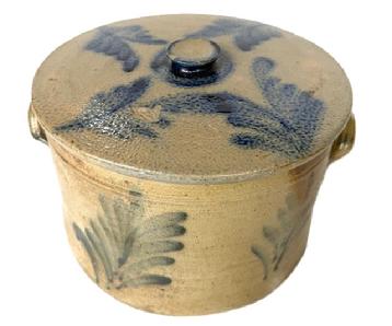 D410 Pennsylvania stoneware lidded cake crock, 19th c., with cobalt foliate sprays. Measurements:  7" tall with lid x 10 ½ dia. 