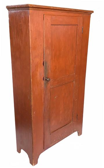Early 19tth century Pennsylvania Chimney Cupboard, the door has double panels, that is full mortised and pin. Small lamps tongue corners, the case of the cupboard is dovetailed with a nice high cut out base. The wood is pine circa 1820 Measurements are 14 ¼� deep x 36 ½� wide x 65 1/2 � tall