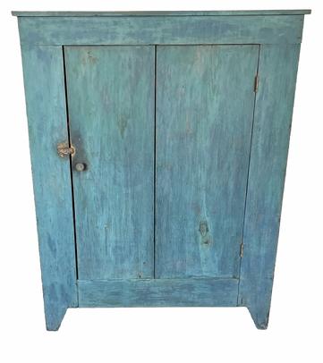 G788  19th century (Forsyth County)  North Carolina one door cupboard in original blue paint. . All square head nail construction with tall cut out feet. Great size and condition! 