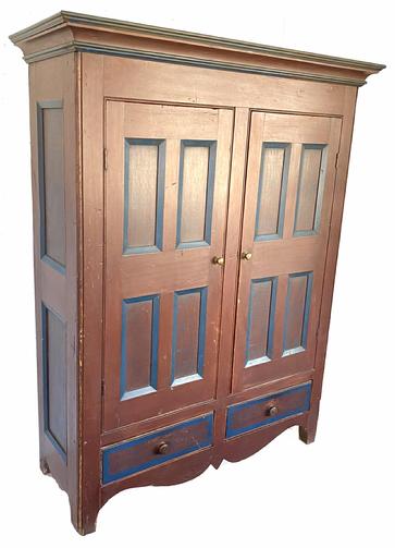 H504 19th century Pennsylvania flat wall cupboard / kas featuring two doors above two dovetailed drawers in beautiful red and blue paint with paint decorated panels and drawer fronts. Beaded edges around doors, drawers and on corners, along with detailed molding around top and tall, decorative double drop cut out apron and ends add to the visual appeal of this wonderful cupboard. Each end has two panels, while each door boasts four panels. Three wooden interior shelves for storage. Clean, natural patina interior. Measurements: The case measures 52 ¼� wide x 19 ¾� deep. The top molding measures 58 ¾� wide x 22 ¾� deep. Overall height is 73 ¾� tall. 