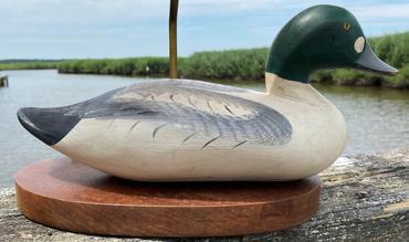 F300 Madison Mitchell 1965 golden eye duck decoy in original paint - currently attached to wooden platform and used as a lamp display