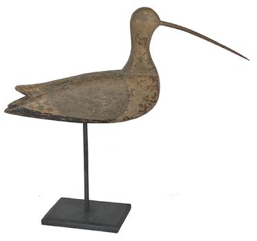 G926 Curlew carved in the Long island style with carved eye, pitchfork tine bill, grain painted finish, with applied wings  mounted on a wooden base for displaying   Measurements are 17" bill to tail and stands 15" tall