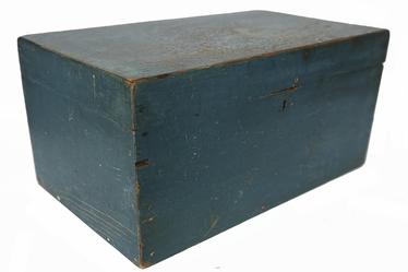 RM1451 Beautiful Massachusetts document box retaining original blue painted surface. Clean, natural patina interior features an open glove till and applied interior molding around the opening to help keep dust and moisture from seeping inside the box. �T� nail construction. Circa 1790 � 1810. Measurements: 20� wide x 12� deep x 9 ¾� tall.  