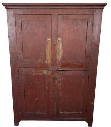 J470 19th century Pennsylvania original red painted flat wall pantry. Two doors over two door configuration resting on cut out feet. The doors are all fully mortised and pegged. The case is square head nail construction. The 20 deep interior shelves are one board! Circa 1840s. Clean, natural patina interior. This is a very sturdy and well-made cupboard. Measurements: 41 wide x 24 deep. (Case measures 48 wide x 22 ½ deep). Overall height is 72 tall.