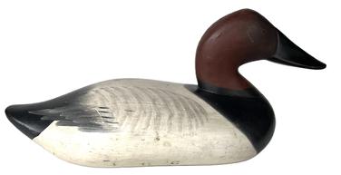 K159 Canvasback Decoy carved by Madison Mitchell (1901-1993) of Havre De Grace, MD in original paint.  Decoy is branded "L H C" in three locations on bottom. Missing the staple, ring and weight.  