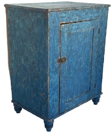 K1854 Mid-19th century York County, Pennsylvania one door cupboard with original blue painted surface and turned feet. The fully mortised door is surrounded with a crisp beaded edge and opens to reveal a clean, natural patina interior. Case is dovetailed at the bottom. Circa 1850s.