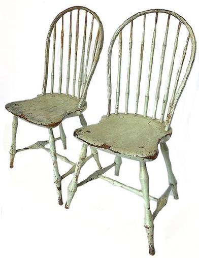 K1851 Pair of early 19th century Pennsylvania seven spindle bow back Windsor chairs bearing original painted surfaces. Circa 1800-1820. All original. Measurements: 16 ½ wide across fronts x 15 ¾ deep x 37 tall back. The seats are 17 ½ tall.   