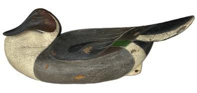 **SOLD** RM1566 - Pintail Drake Decoy in a breast-preening pose carved by William �Wild Bill� Kennedy of Havre de Grace, Maryland. Signed and dated 2011 on bottom. Original staple and ring remain intact on bottom. Approximate measurements:  ~17 &frac14;� long x ~7 &frac12;� wide x ~7� tall. 