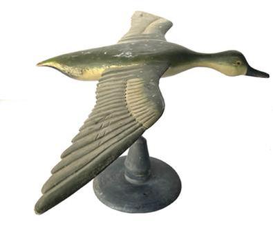 J230 Full sized Flying Duck Decoy with very detailed carved wings and nice dry, original painted surface. Carver unknown. Mounted on a wooden base for display purposes. Measurements: 31 &frac12;� wingspan x 18 &frac12;� beak to tail. The base is 8 &frac34;� diameter. Overall mounted height is 13 &frac12;� tall.