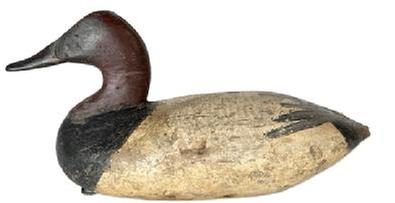 L222 Branded Upper Bay Canvasback Duck Decoy � attributed to Graham - branded "CA" and HBS" (for H.B Strong who hunted near Remington Farms) on bottom. Original weight, ring and staple remain intact on bottom. Early second coat of working painted surface with areas of original paint showing as well as evidence of being shot over. 