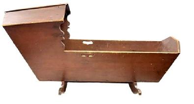 M326 Early 19th century Pennsylvania original red painted Hooded Cradle with canted, dovetailed case resting on shaped rockers. There is a decorative cutout handle on each side and shaped sides below the hood. The interior of the cradle is painted red also. The wood is pine, dovetailed with square head nail construction. Measurements: 50 &frac34;� long x 18 &frac12;� wide (hood) x 15 &frac12;� wide (case) x 24� tall (hood).  