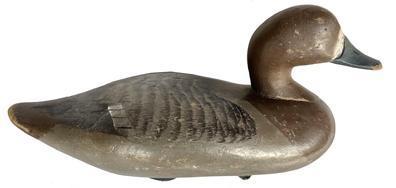 J246 Bluebill Hen decoy carved by Madison Mitchell (1901-1993) of Havre de Grace, Maryland. Original painted surface. Original weight, ring and staple intact on bottom. Circa 1940s. 