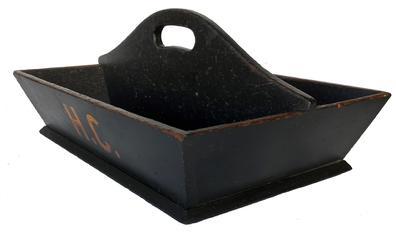 F361 Mid 19th century cutlery tray, with wonderful black paint, with initials on the side in mustard paint, H.C. one board bottom all square nailed construction, high arched divided with cut out handle circa 1840-1850