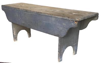 G648 19th century Pennsylvania sturdy wooden bench in old dry gray paint over original gray paint. Bench features tall half-moon cut out feet and wonderful dropped apron sides that hang down 7 1/2�. All square head nail construction. Pine wood. Circa 1860s.