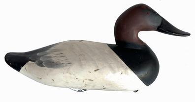  J318 Canvasback Decoy carved by Charlie Speed Joiner (1921-2015) of Chestertown, MD. Original paint with wide bill, signed and dated 1965  retains original iron weight and ring on bottom.   Approximate measurements: 15 1/2" long x 6 3/4" wide x 8 1/4" tall